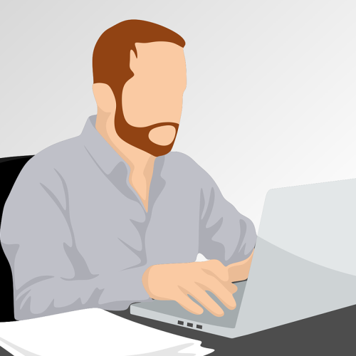 Illustration of a bearded man sitting at a desk, working on a laptop, with papers on the desk. About Us